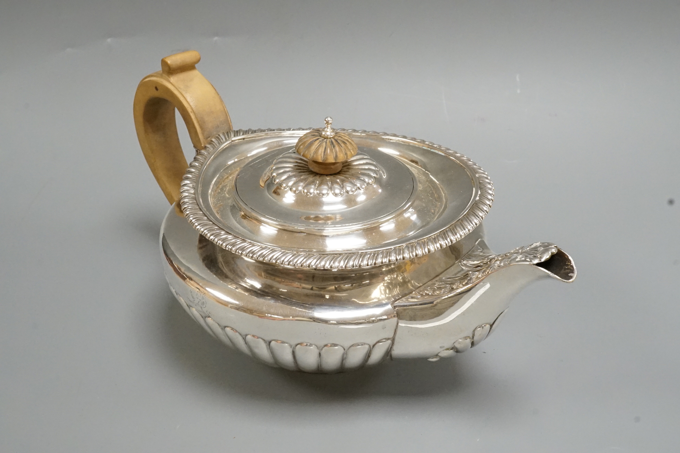 A George IV demi fluted silver teapot, Emes & Barnard, London, 1824, gross weight 20.6oz.